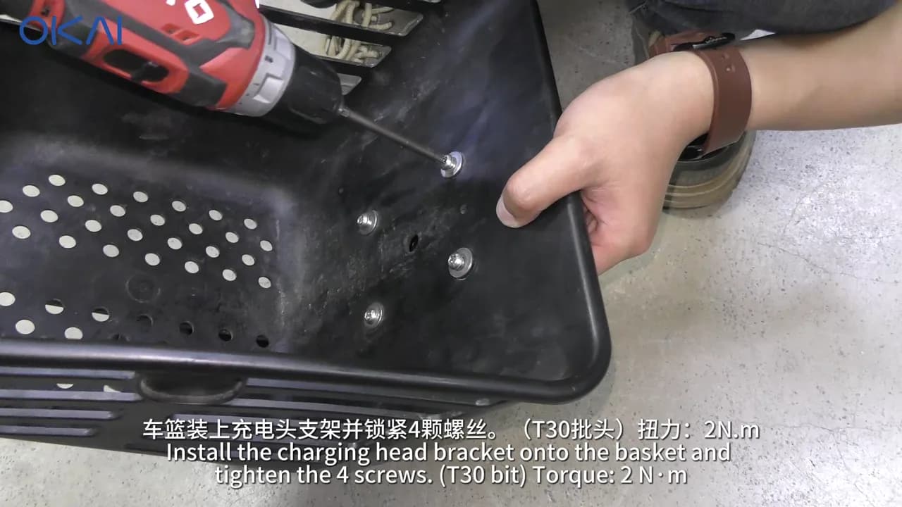 OKAI EB100B charging connector mounted under the basket