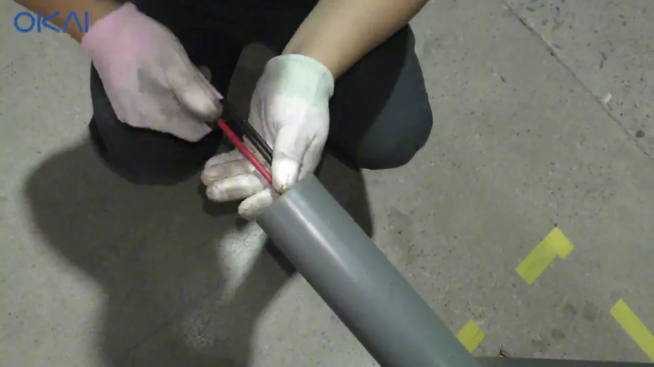 Technician pulling the solar mast cable through the mast