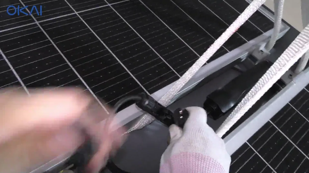 Technician connecting the solar panel cable